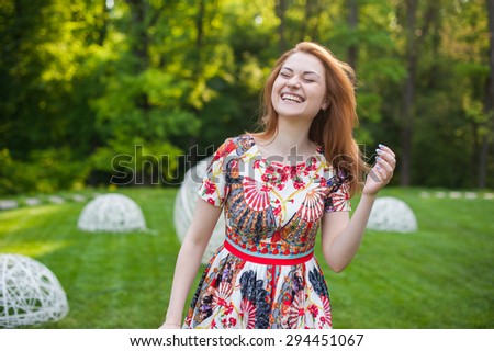 Beautiful young woman smiling portrait on nature, the joy of life, smile