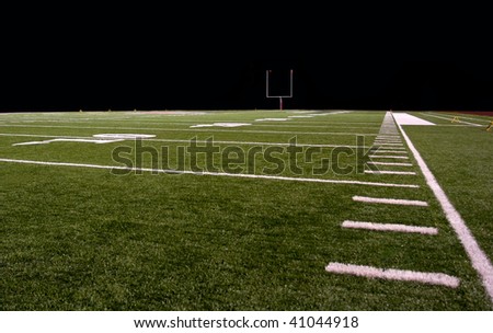 Synthetic turf football field at night