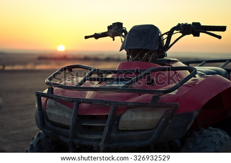 ATV Quad Bike in front of sunrise in the desert