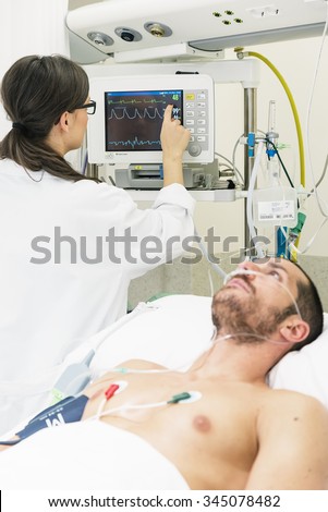 Doctor is caring a sick man in hospital
