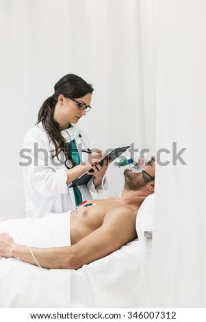Doctor is caring a sick person in hospital