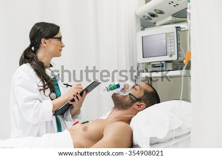 Doctor is caring a sick person in hospital