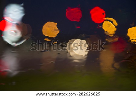 Colorful Water Abstract - the street lights of the city create an abstract display
