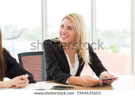 Portrait of young beautiful business woman wear formal suit sitting and meeting at office desk in the office with happy and smile