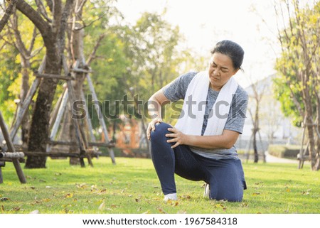 Old Asian people suffer from exercise pain. old woman suffering from a sore knee.