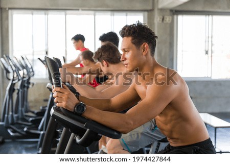 Man running on treadmill in the gym. Group of people running on treadmill in the gym. Group of athletes exercise on treadmill in the gym
