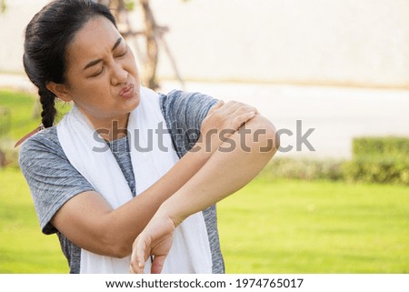 Old Asian people suffer from exercise pain. senior woman suffering from sore arm.