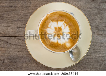 Mocha coffee drink on the table light wood.