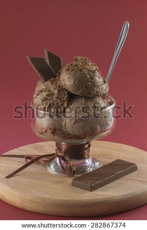 chocolate ice cream and chocolate on a red background