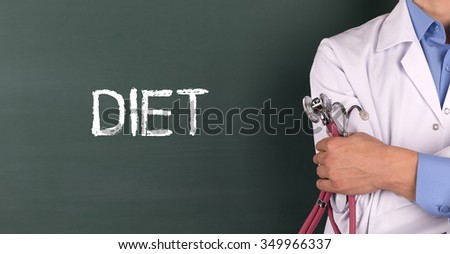 Doctor Standing front of Blackboard written DIET