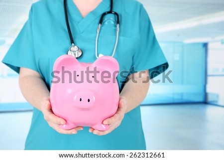 Health care worker with Piggy Bank