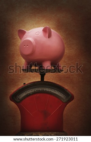 Piggy Bank on vintage scales
