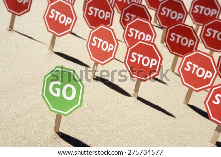 Go and stop signs at beach