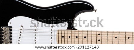 Classic shape black and white electric guitar with wooden maple neck isolated on white with clipping path. Musical instruments shop or school concept. Letterbox view