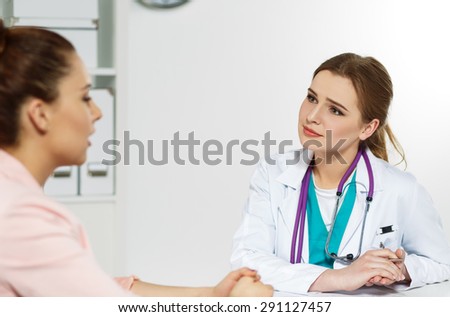 Concerned beautiful female medicine doctor listening carefully patient complaints. Medical care or insurance concept. Physician ready to examine patient and help. Partnership trust and ethics concept