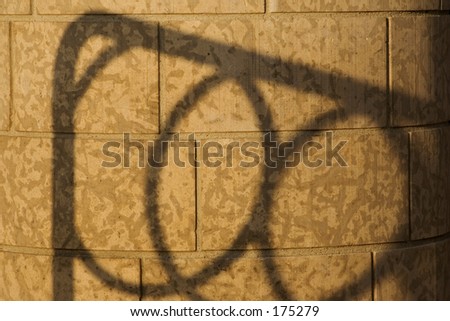 Shadow of a Bike Rack on a Brick Wall