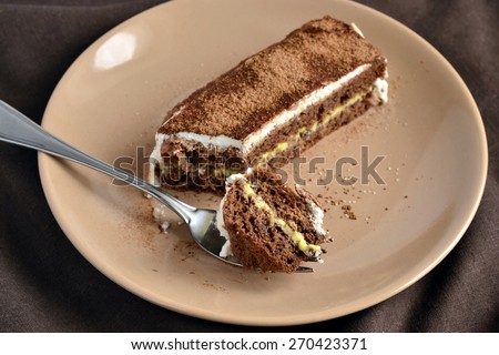 Chocolate sponge cake with lemon cream and whipped cream