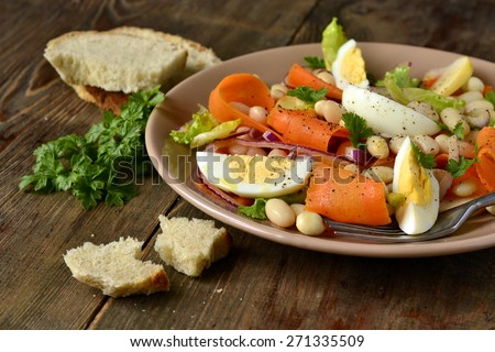 Salad with beans, egg, carrot and apple