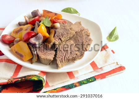 Boiled beef with baked vegetables