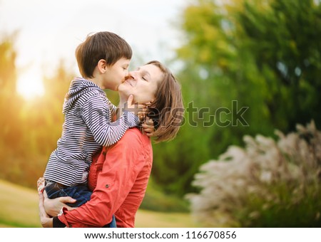 Son is kissing his mother