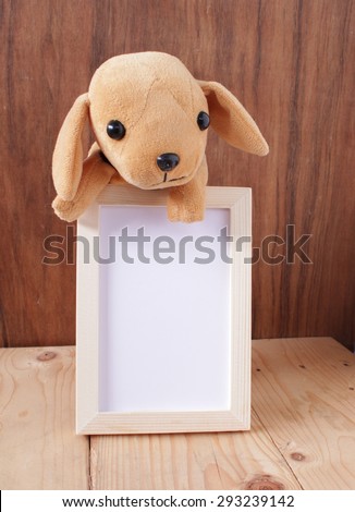 photo frame,doll,dog,puppy