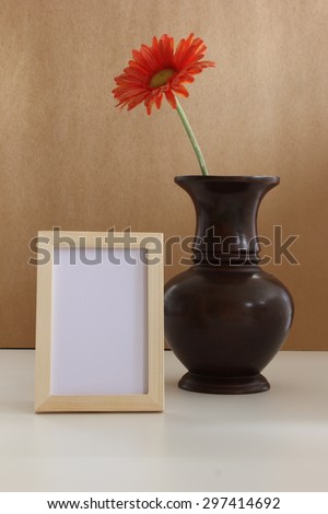 frame photo and wooden  vase of flower