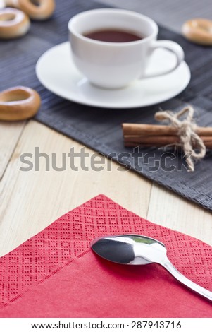Black tea in a mug on a table in clear weather