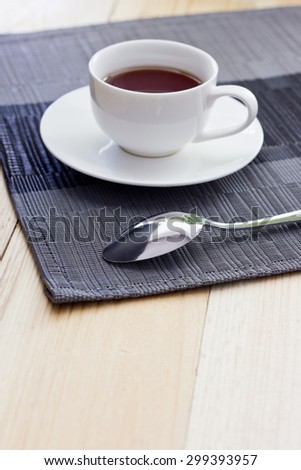 Tea in a white circle on a light table