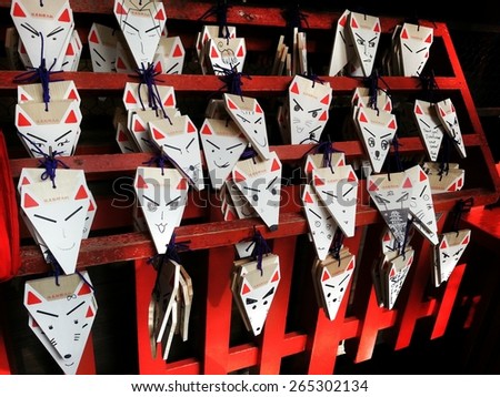 KYOTO, JAPAN - CIRCA APRIL 2014 - Japanese Fox shape Wooden Wishing Plaques