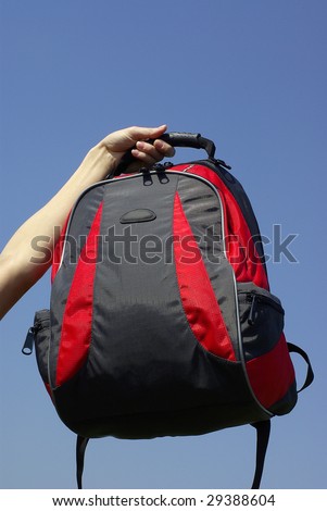 Modern and fashionable backpack in a hand