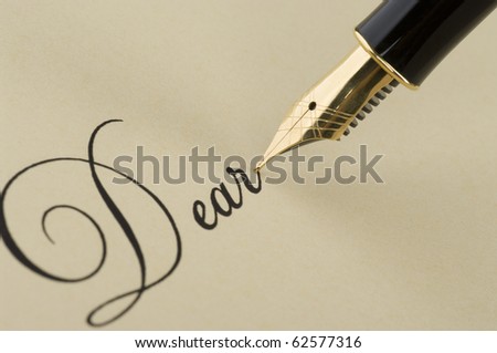 Inscription Dear with gold pen