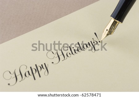 Inscription Happy Holidays with gold pen