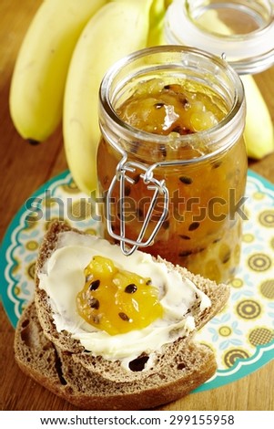 Banana Passion Fruit Jelly / Confiture in Glass Jar on Wood
