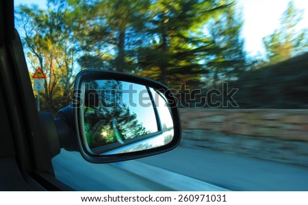 View in the car mirror at speed