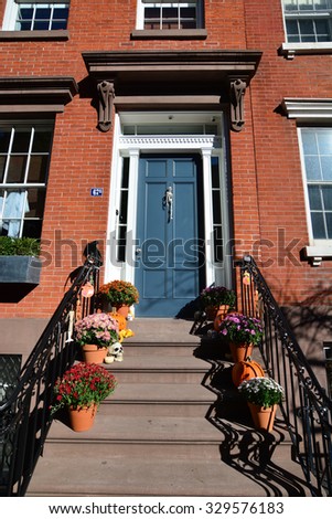 Halloween house new york/ Halloween/ New York, USA - October 19, 2015: House steps and entrance decorated for Halloween in manhattan new york with pumpkins