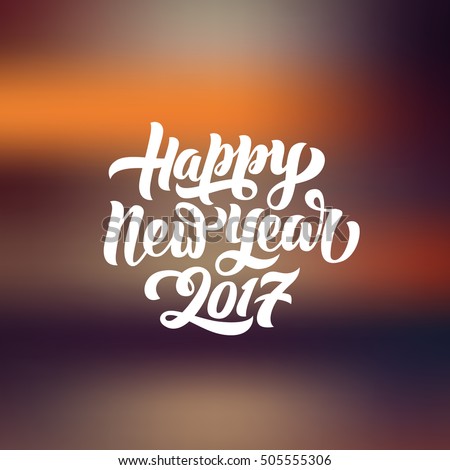 Happy New Year 2017 hand-lettering text on blurred background. Handmade vector calligraphy collection