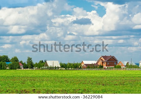 Suburban housing development encroaching on farm fields