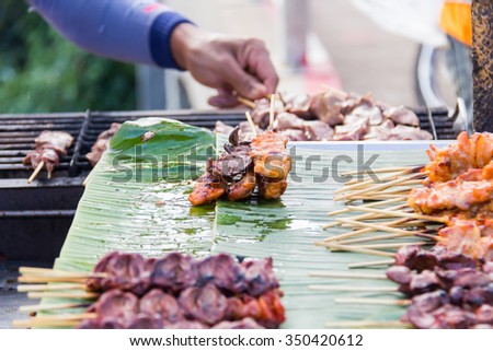 Grilled Chicken Wings, chicken liver as Thai style at street food in Thailand.