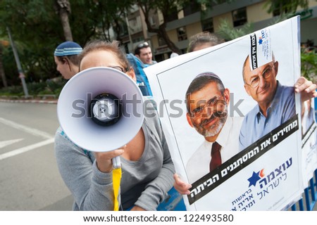 TEL AVIV, ISRAEL - DECEMBER 7: Right-wing demonstrators support Michael Ben-Ari and Aryeh Eldad of the Otzma LeYisrael or \