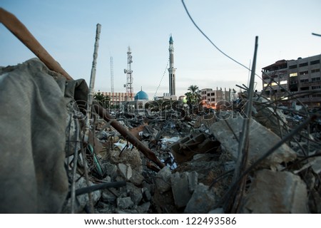 GAZA, PALESTINIAN TERRITORY - DECEMBER 2: A mosque rises above a field of rubble at Abu Khadra complex for civil adminIstration, destroyed by Israeli air strikes, Gaza City, December 2, 2012.