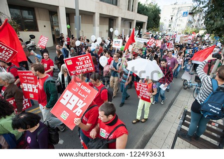 TEL AVIV, ISRAEL - DECEMBER 7: Members of the leftist Israeli political party Hadash march in red during the annual human rights march in Tel Aviv, Israel, December 7, 2012.