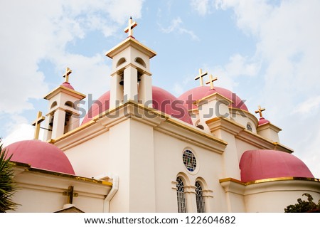 Crosses and pink domes decorate the roof of the Greek Orthodox Church of the Seven Apostles near Capernaum on the Sea of Galilee in northern Israel.