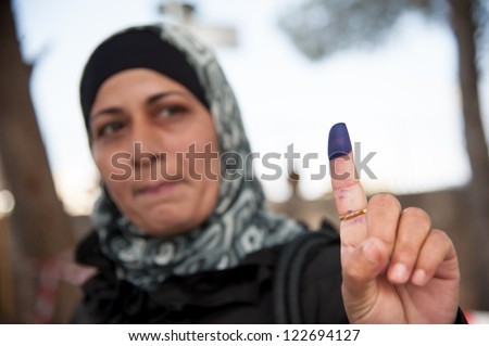 BETHLEHEM, PALESTINIAN TERRITORY - OCTOBER 20: A woman shows her ink-stained finger, indicating that she has voted in Palestinian municipal elections, Bethlehem, West Bank, Oct. 20, 2012.