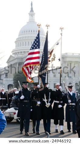WASHINGTON, DC - JAN 20: A color guard representing all branches of the U.S. Armed Forces march past the U.S. Capitol as part of the 2009 inaugural parade of President Barack Obama.