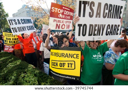 WASHINGTON, DC - OCTOBER 22: Health-care reform advocates march in the streets outside of a meeting of America\'s Health Insurance Plans (AHIP) on October 22, 2009 in Washington, DC.