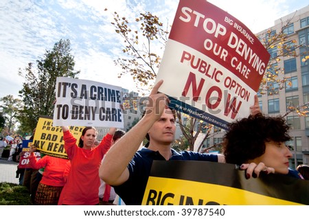 WASHINGTON, DC - OCTOBER 22: Health-care reform advocates march in the streets outside of a meeting of America\'s Health Insurance Plans (AHIP) on October 22, 2009 in Washington, DC.