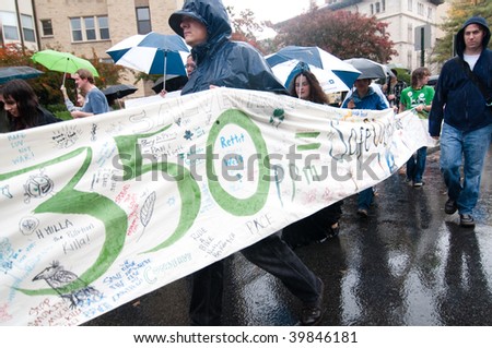 WASHINGTON, DC - OCTOBER 24: Environmental activists call for cutting carbon emissions to 350 parts per million during the International Day of Climate Action on October 24, 2009 in Washington, DC