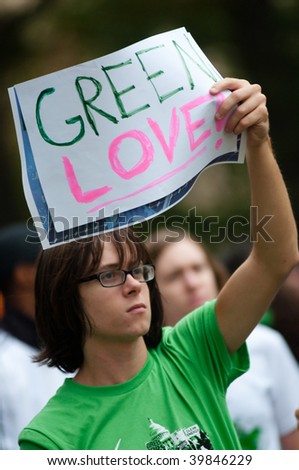 WASHINGTON, DC - OCTOBER 24: An environmental activist holds a sign saying, 