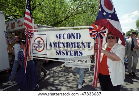 WASHINGTON, DC - MAY 14: Pro-gun activists march as counter-protesters to the Million Mom March, a major rally for gun safety advocates on the National Mall on May 14, 2000 in Washington, DC