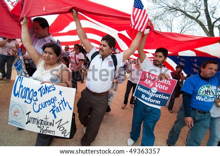 WASHINGTON, DC - MARCH 21: A giant American flag is carried among some 200,000 immigrants\' rights activists flood the National Mall on March 21, 2010 in Washington DC.